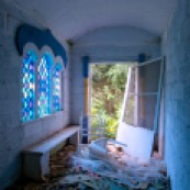 abandoned orthodox church with stained glass and door